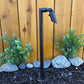 Zone Solid Brass Directional Path Light on a stake, outdoor landscape lighting beside a wooden fence.