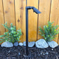 Zone Solid Brass Directional Path Light on a stake, providing focused outdoor illumination.