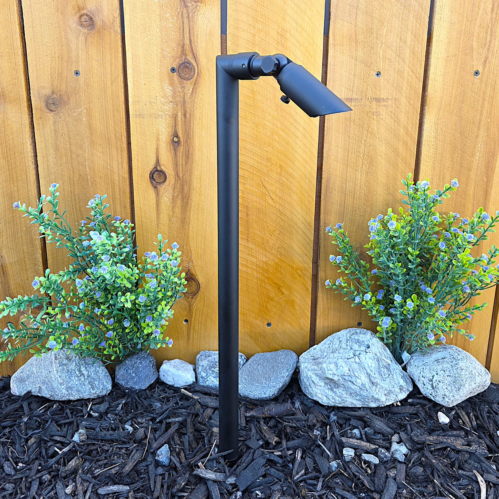 Zone Solid Brass Directional Path Light on a stake, providing focused outdoor illumination.