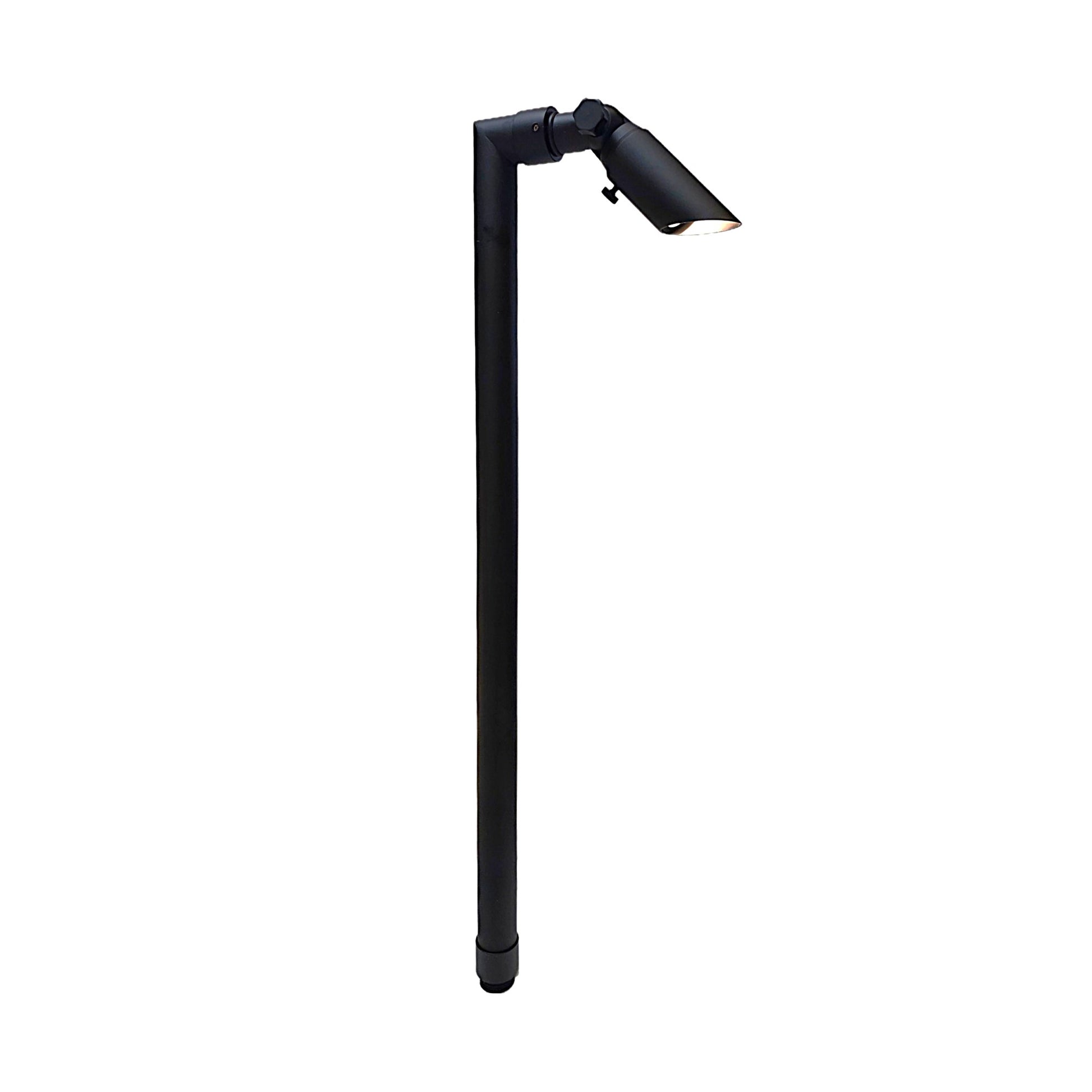 Zone Solid Brass Directional Path Light on a stake with adjustable head directing downward outdoor illumination.